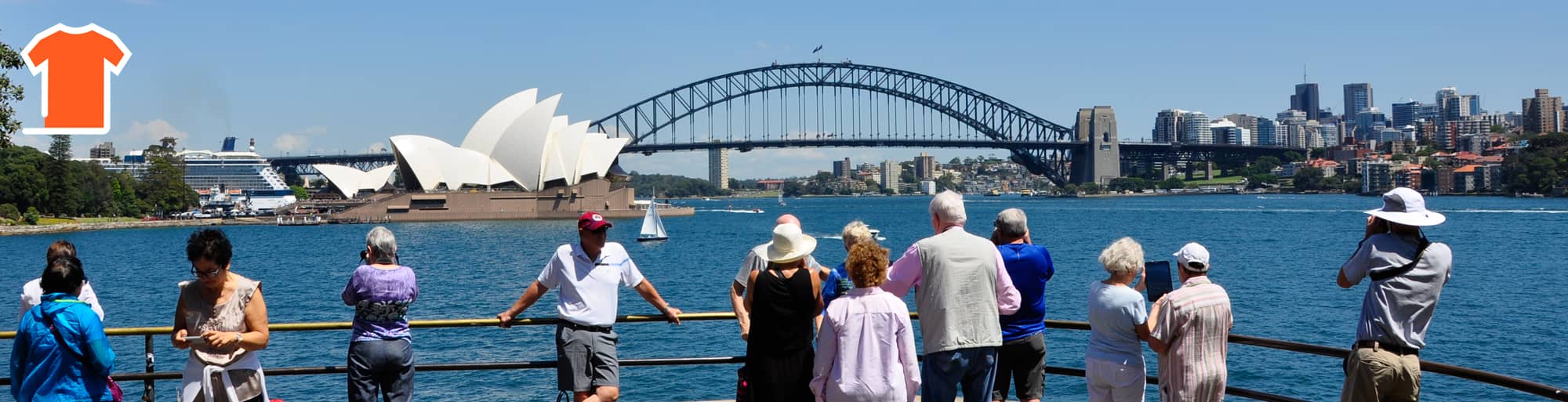 Visitors enjoy a panoramic vista of Sydney Harbour from Mrs. Macquarie's Chair, with the Sydney Opera House and Harbour Bridge as the centrepieces.