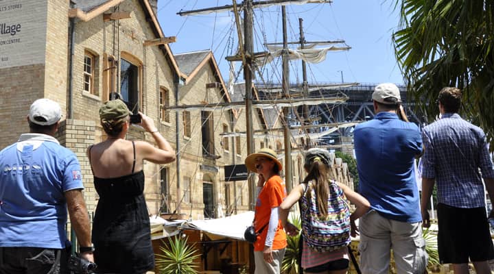 A group of tourists listening stories of early colony